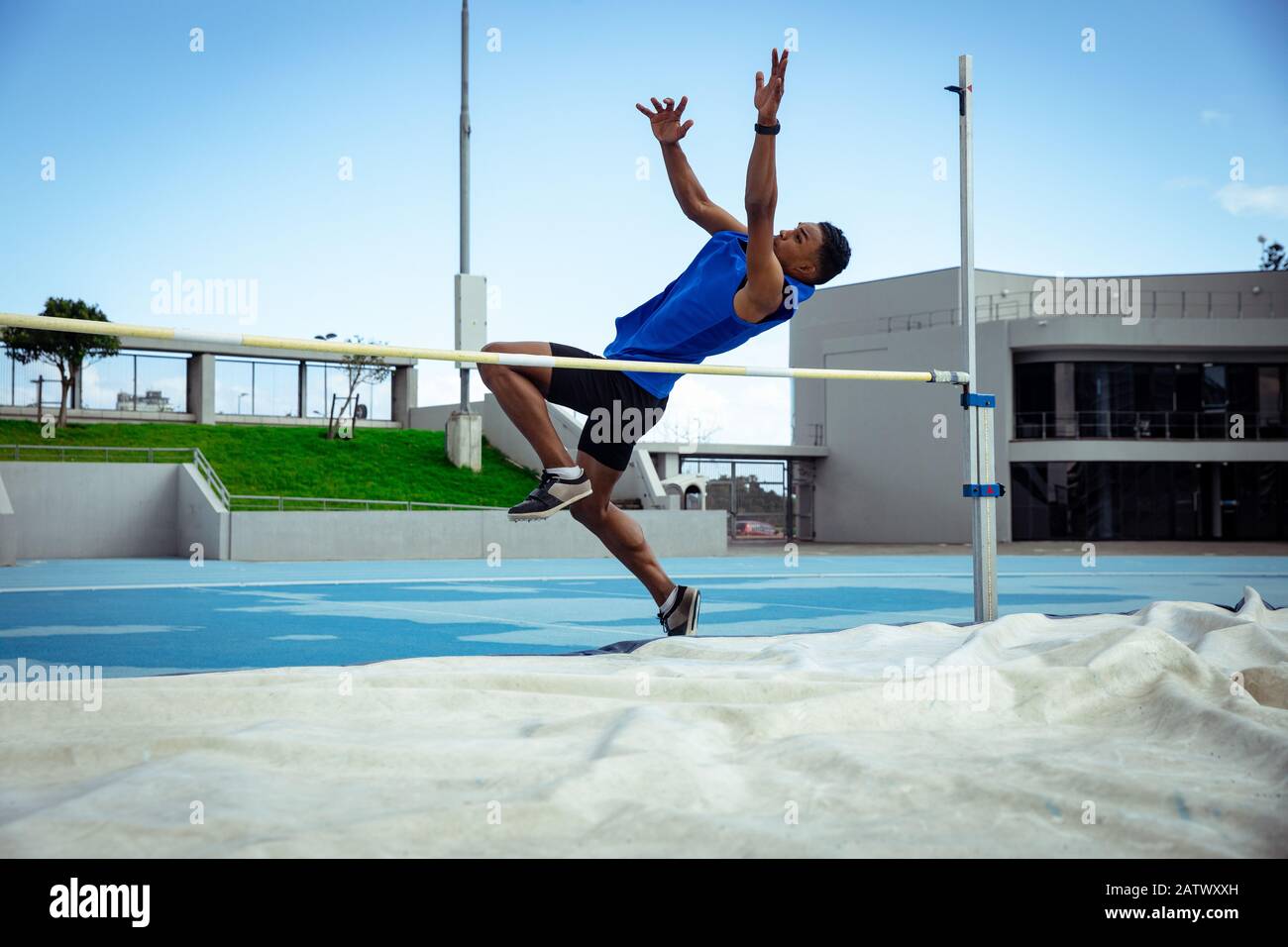 Athlete doing a high jump Stock Photo