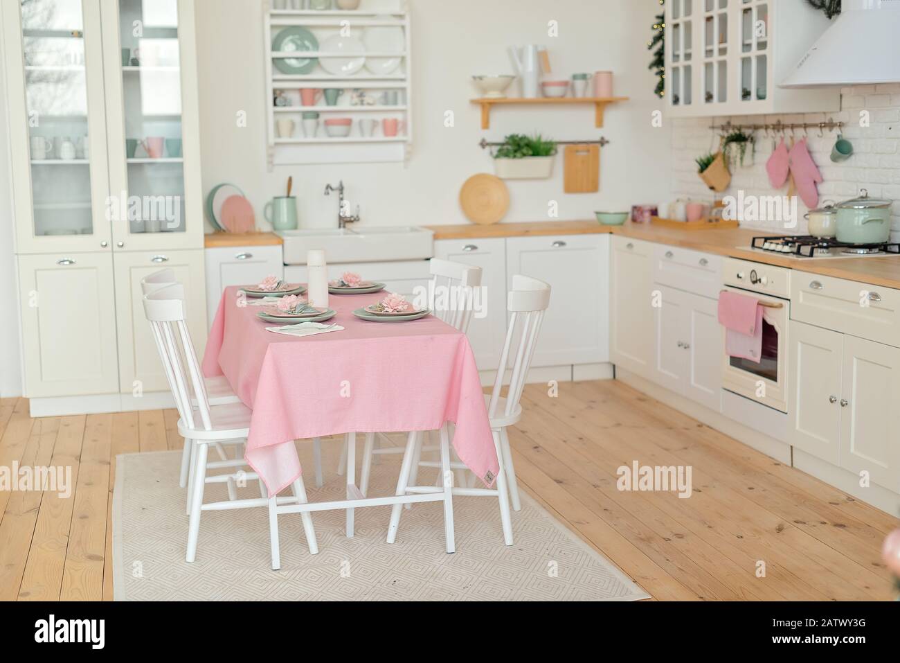 Light modern kitchen with white and rose colours Stock Photo - Alamy
