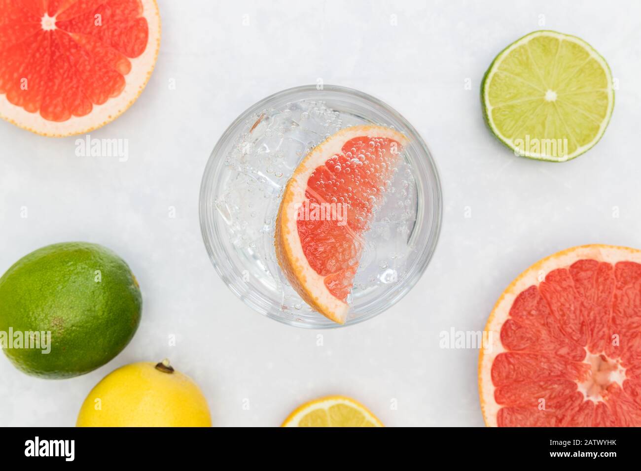 Pink gin tonic vodka soda fruit grapefruit cocktail drink in glass with