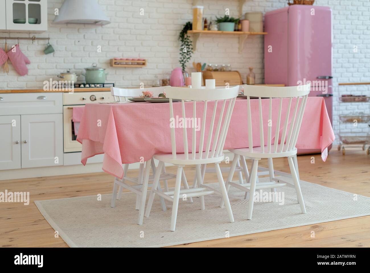 Light modern kitchen with white and rose colours Stock Photo - Alamy
