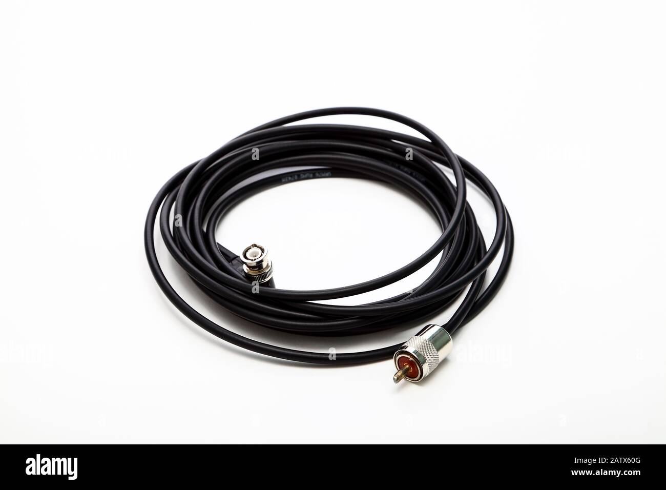 Coil of 50 ohm coaxial cable with a pl259 connector at one end and a ...