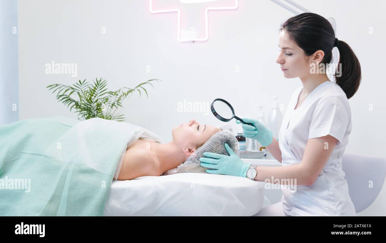 Examining skin hires stock photography and images Alamy