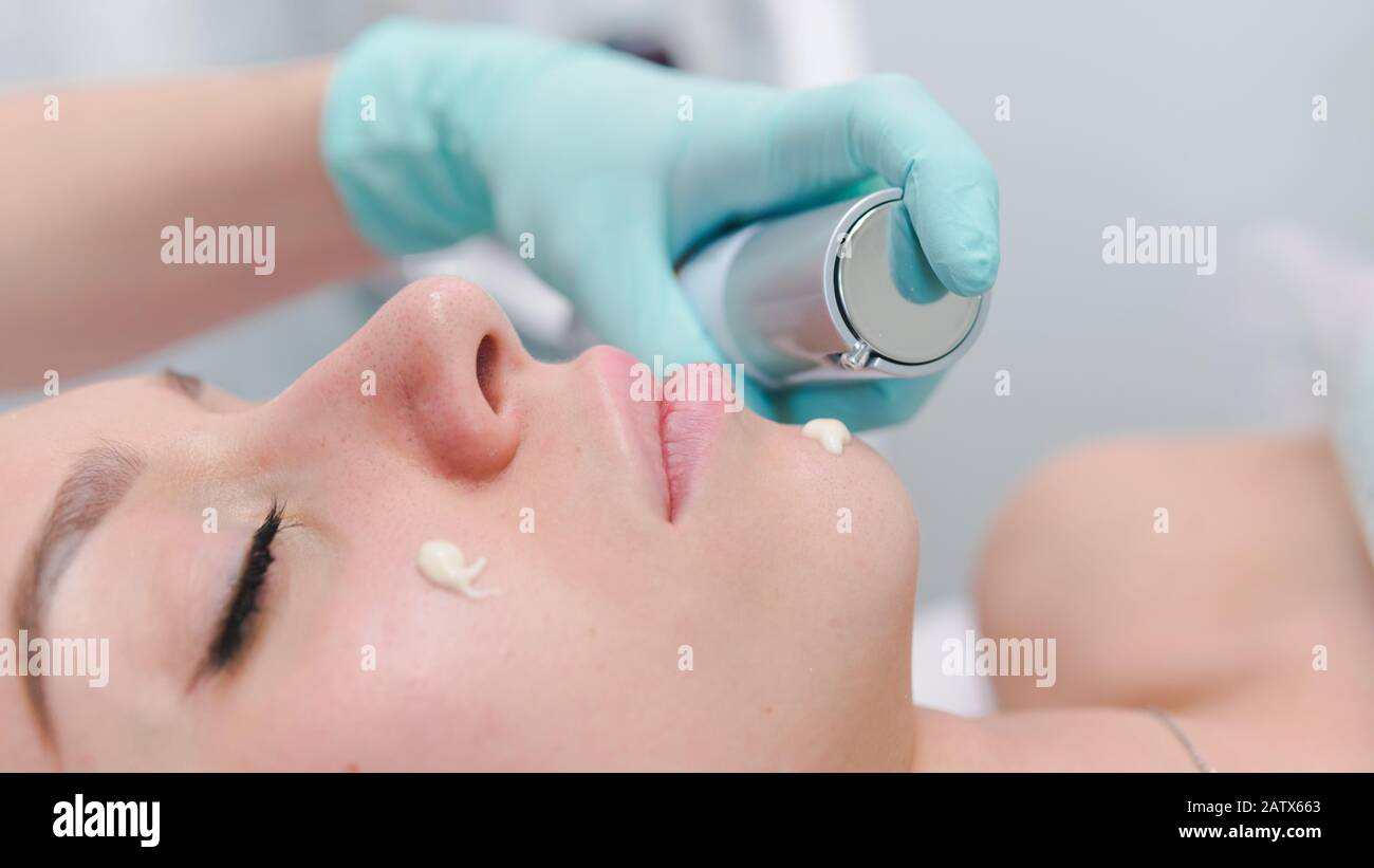 The female dermatologist do face massaged to beautiful girl cosmetology