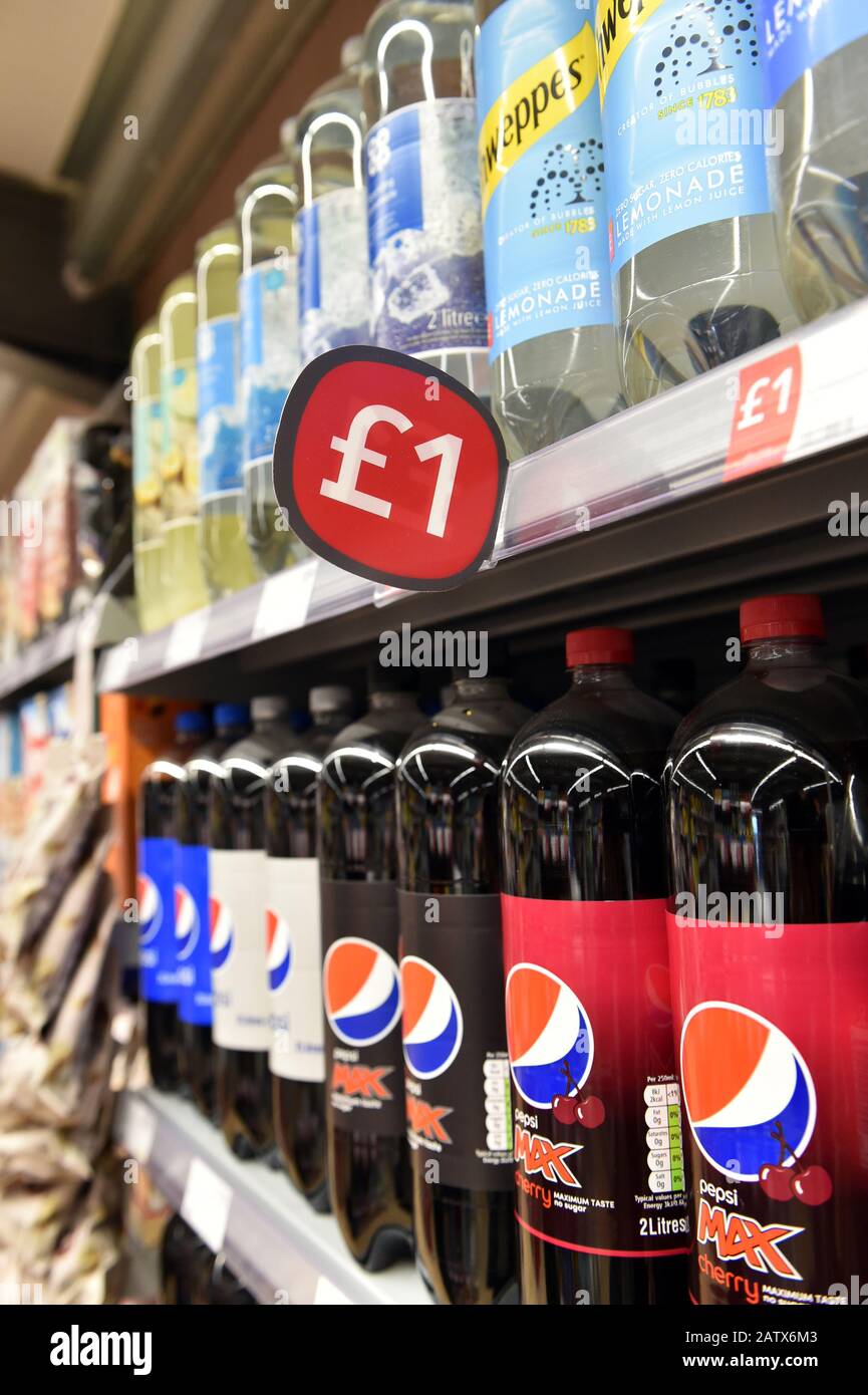 Bottles of pop for sale in a shop Stock Photo
