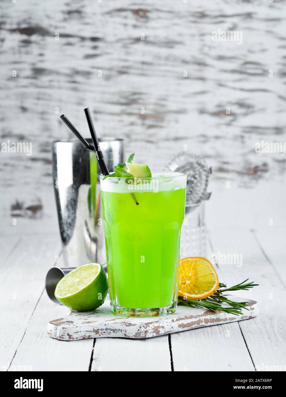 Cocktail Jungle Juice. Green Alcoholic Cocktail. On a wooden background.  Top view. Free copy space Stock Photo - Alamy