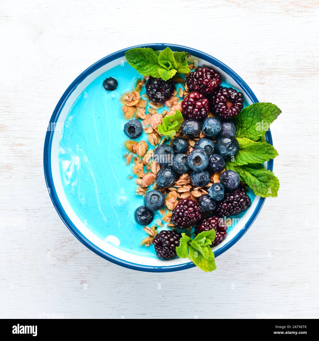 Blue Spirulina and Fresh Fruit Smoothie Bowl Topped with blackberries,  blueberries, granola and yogurt. Breakfast. Top view. Free space for your  text Stock Photo - Alamy