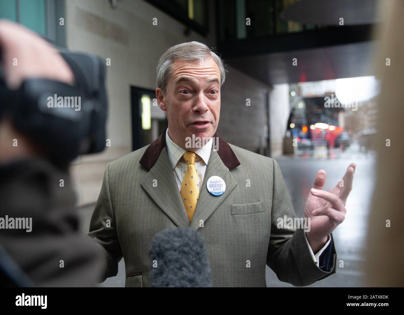 Brexit Party Leader, Nigel Farage, arrives at the BBC Studios holding the commemorative 50p coin, dated 31 Jan 2020 to mark Britain's exit from the EU. Stock Photo