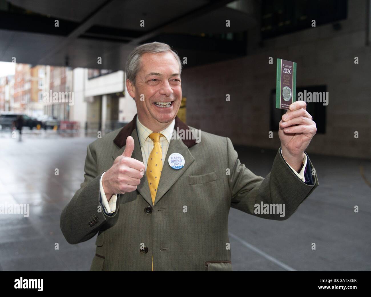 Brexit Party Leader, Nigel Farage, arrives at the BBC Studios holding the commemorative 50p coin, dated 31 Jan 2020 to mark Britain's exit from the EU. Stock Photo