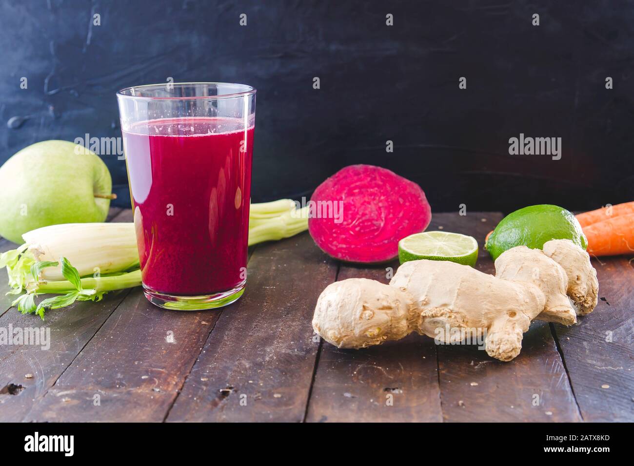 A glass with fresh homemade detox beetroot juice and ingredientsr Stock Photo