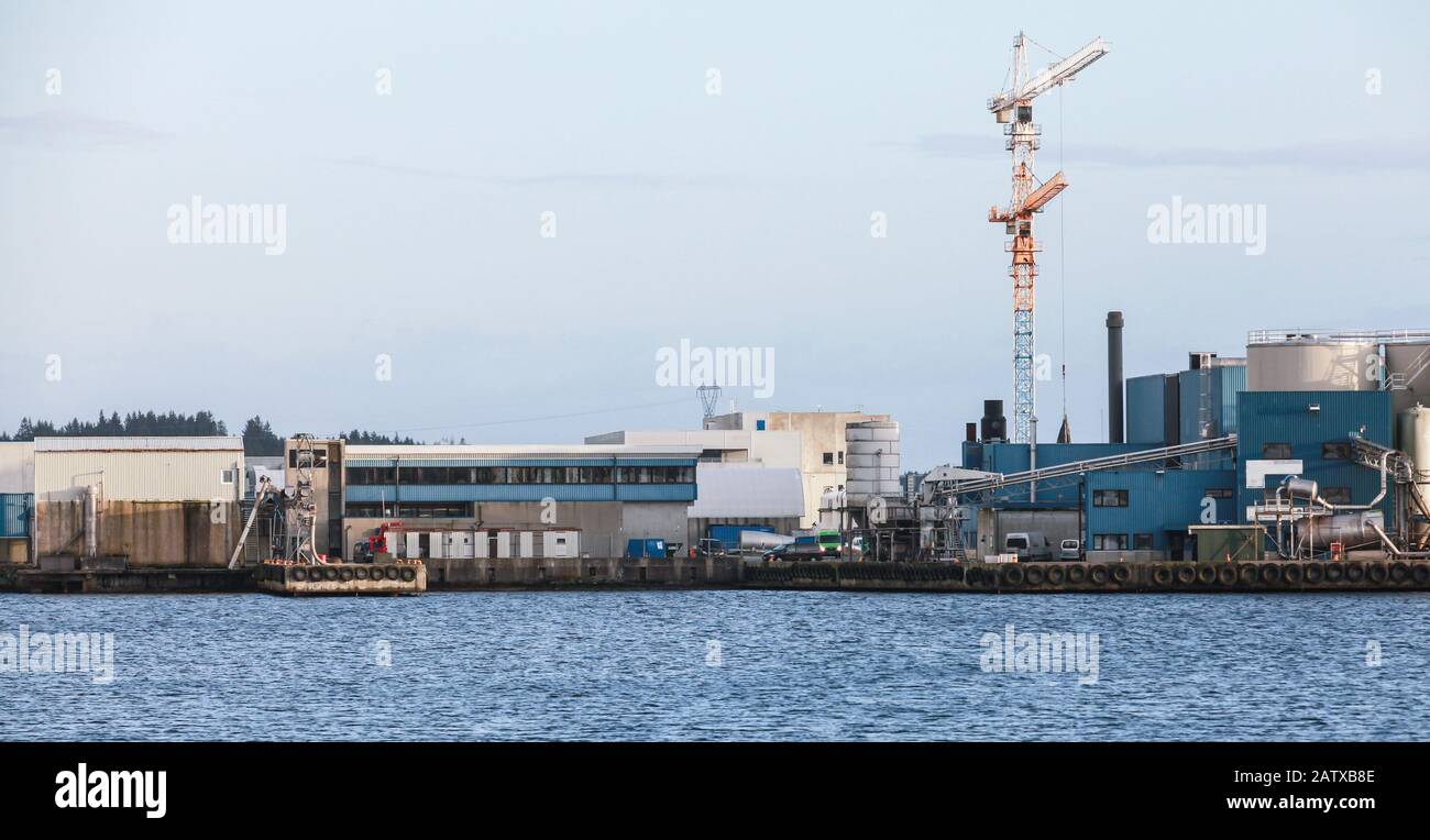 Norwegian industrial landscape with fish meal factory in Karmoy, Norway Stock Photo