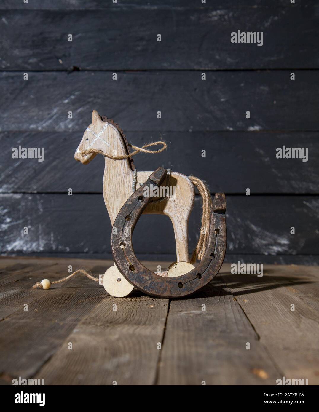 wooden horse horseshoe Stock Photo Alamy