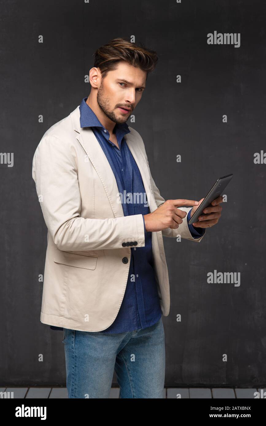 Black man thinking tablet hi-res stock photography and images - Alamy