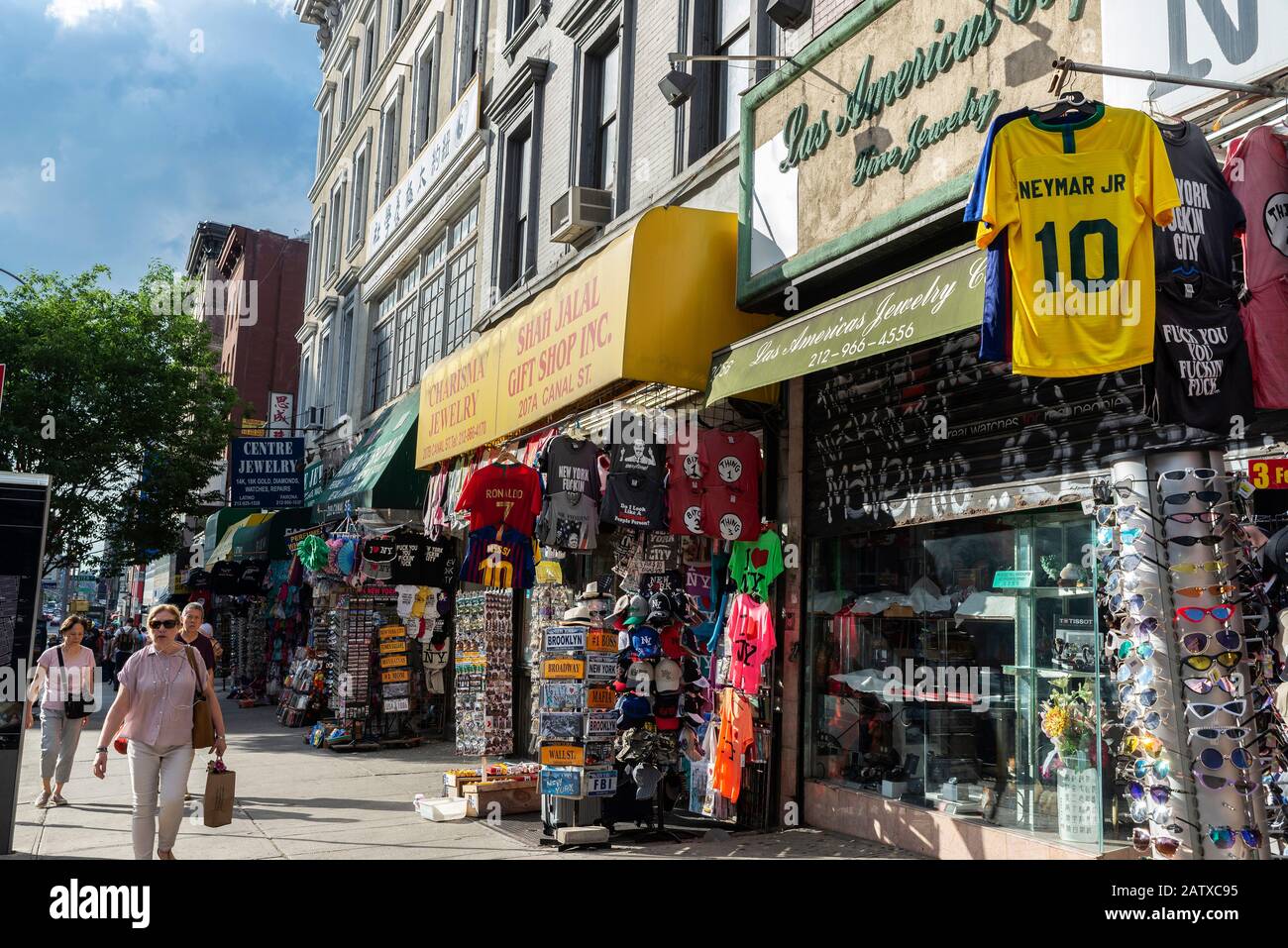New York City, USA - August 2, 2018: Street with many shops and people around in Chinatown, Manhattan, New York City, USA Stock Photo