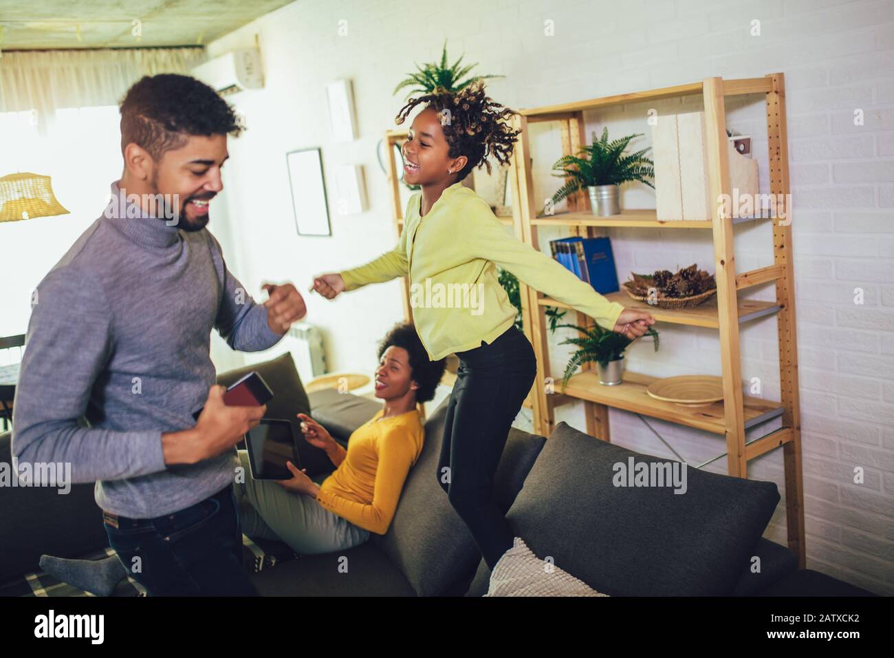 Happy african american family having fun at home Stock Photo - Alamy
