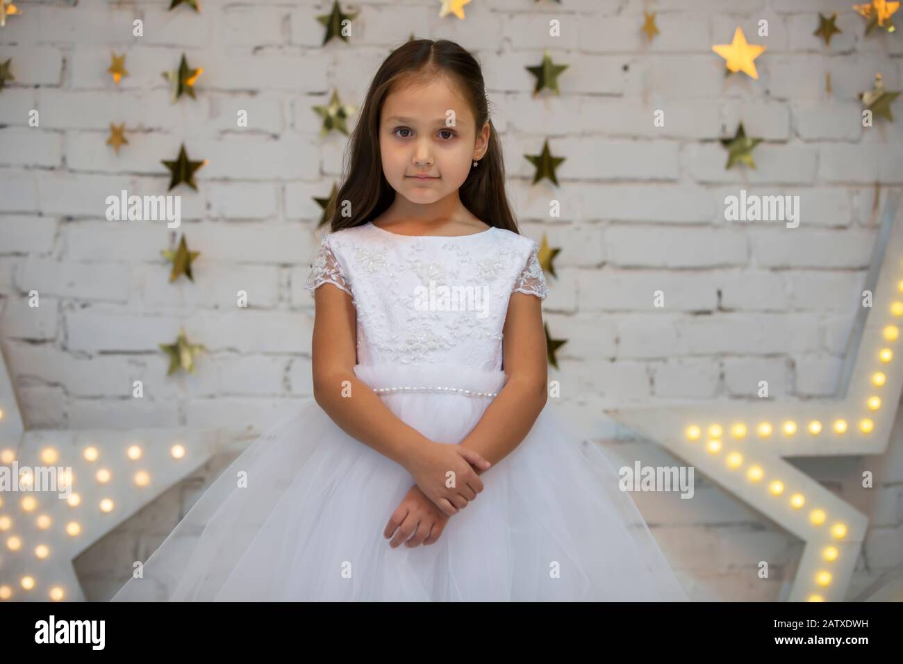 Vertical portrait of indian little girl in elegant dress Stock Photo