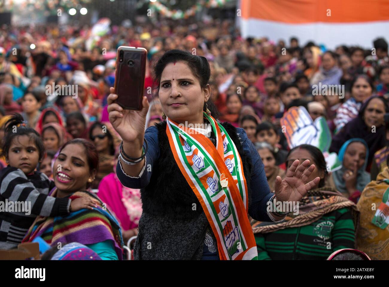 New Delhi, India. 5th Feb, 2020. A supporter of Indian National Congress (INC) takes photos during an election campaign in New Delhi, India, Feb. 5, 2020. Campaigning for upcoming local elections here in the Indian capital reached a crescendo on Wednesday as different political parties are trying hard to woo voters to their side. Credit: Javed Dar/Xinhua/Alamy Live News Stock Photo