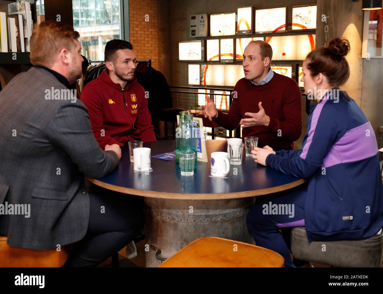 The Duke of Cambridge (second right) speaks with (left to right) Oxford United manager Karl Robinson, Aston Villa midfielder John McGinn and Tottenham Hotspur defender Emma Mitchell during the launch of The Heads Up Weekends at Paddington's Heist Bank, London. Stock Photo