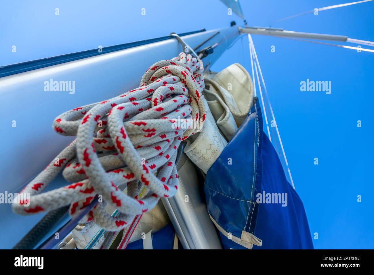 Bottom view of the mast of a sailing yacht. A hank of rope and other rigging Stock Photo