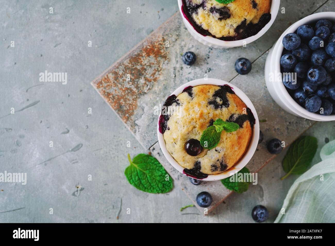 Homemade Blueberry Muffin for one baked in a ramekin, selective focus Stock Photo