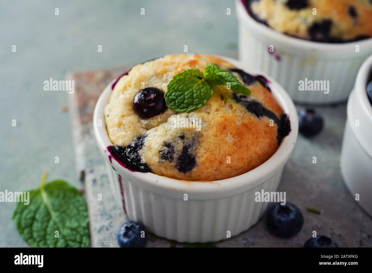 Homemade Blueberry Muffin for one baked in a ramekin, selective focus Stock Photo