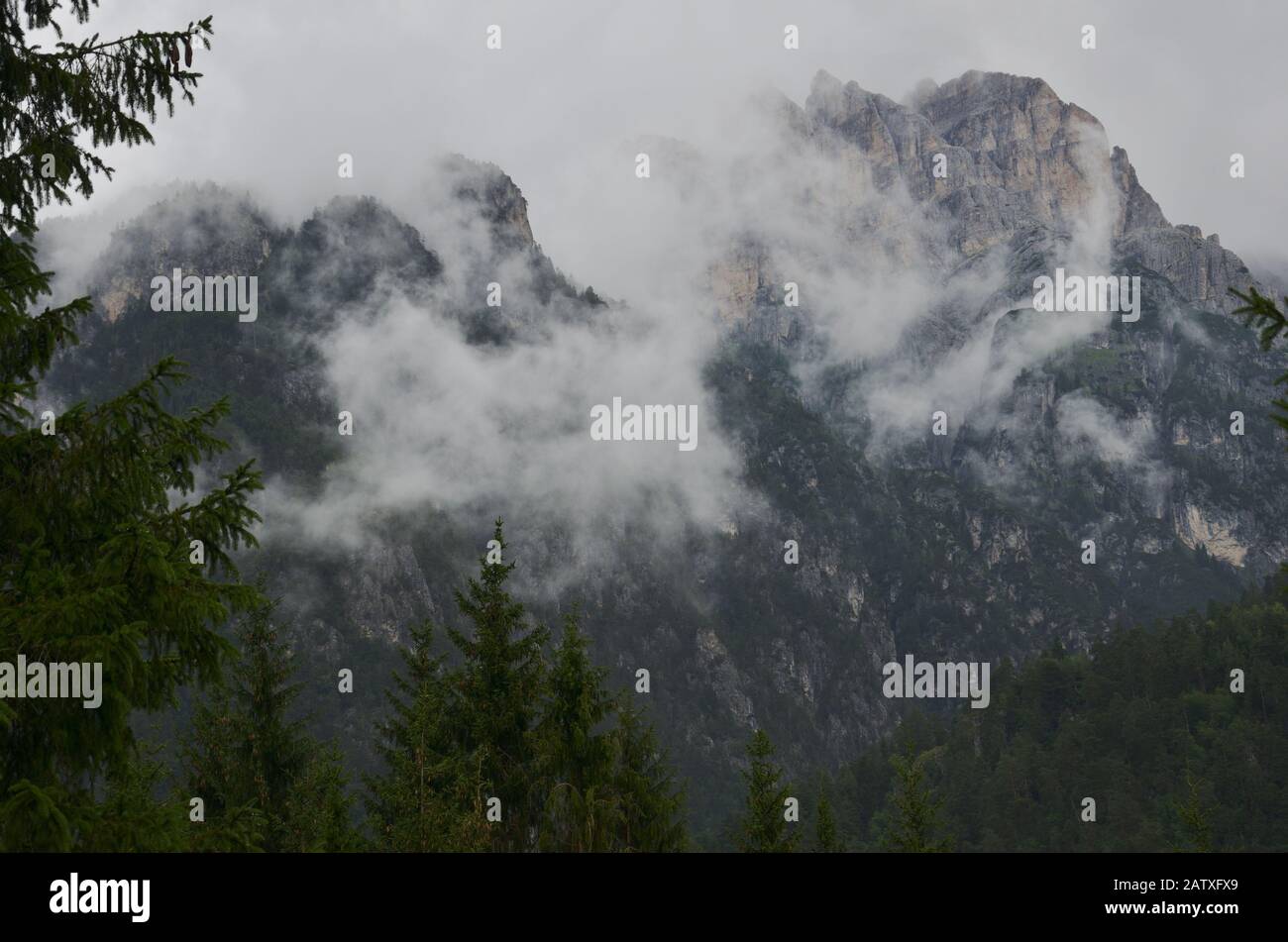 After the rain clouds of steam envelop the mountain peaks Stock Photo