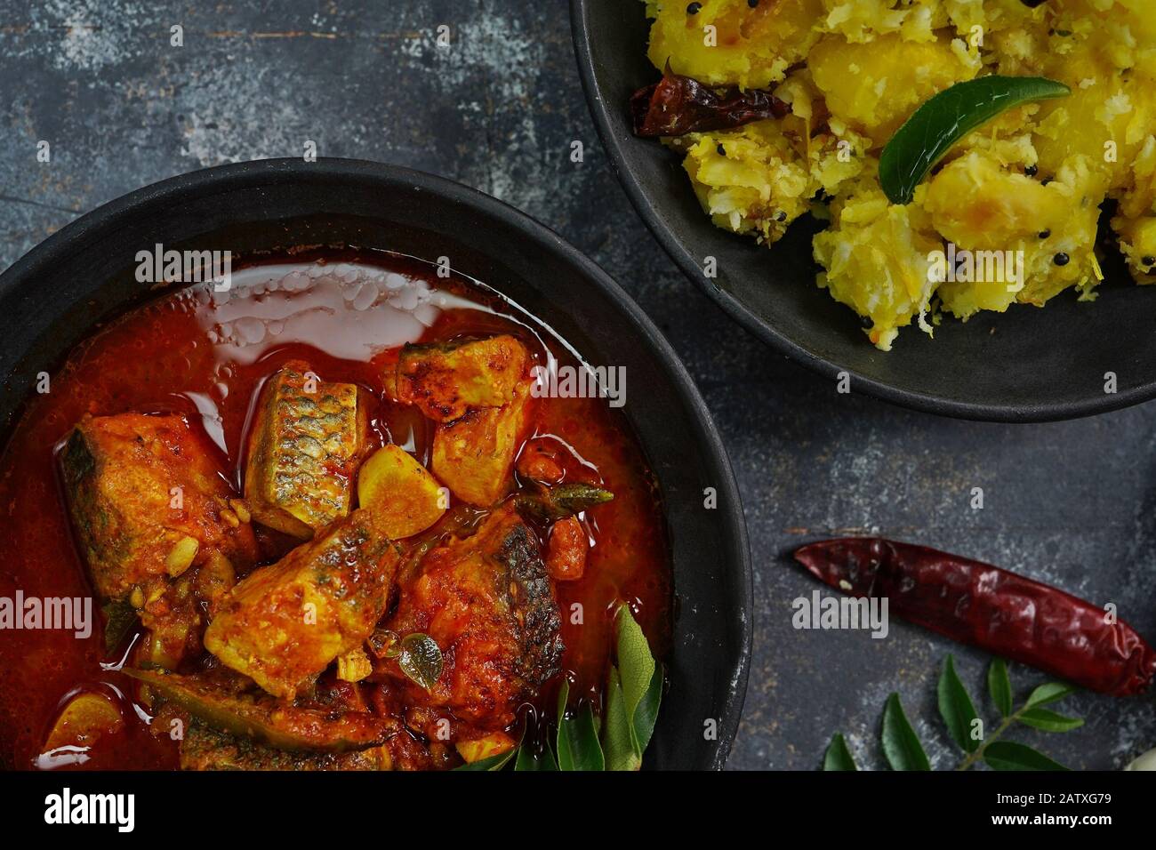 Kappa and meen curry / Spicy Red fish Curry with Cassava or Tapioca Stock  Photo - Alamy