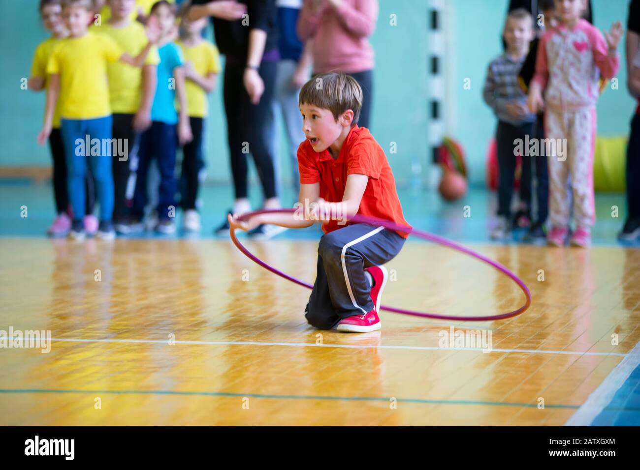 Child in the gym. A schoolboy in a physical education lesson. Relay
