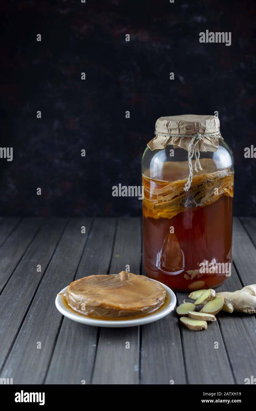 Kombucha superfood pro biotic tea fungus beverage in glass jar with