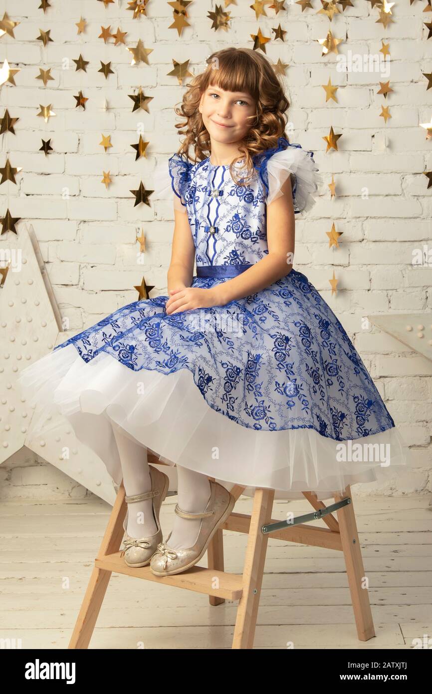 Beautiful little child girl in an elegant dress Stock Photo - Alamy