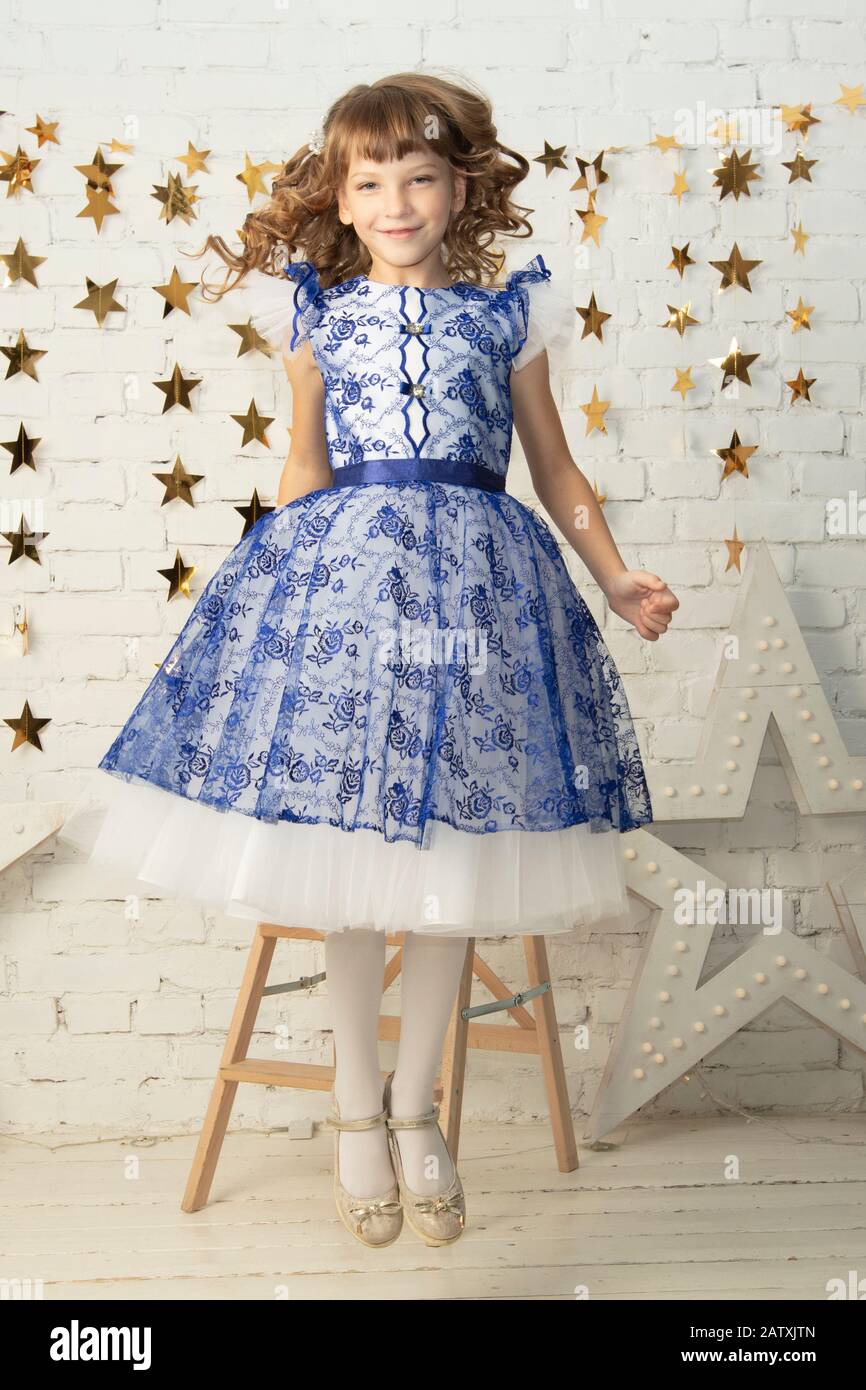 Beautiful little child girl in an elegant dress Stock Photo - Alamy