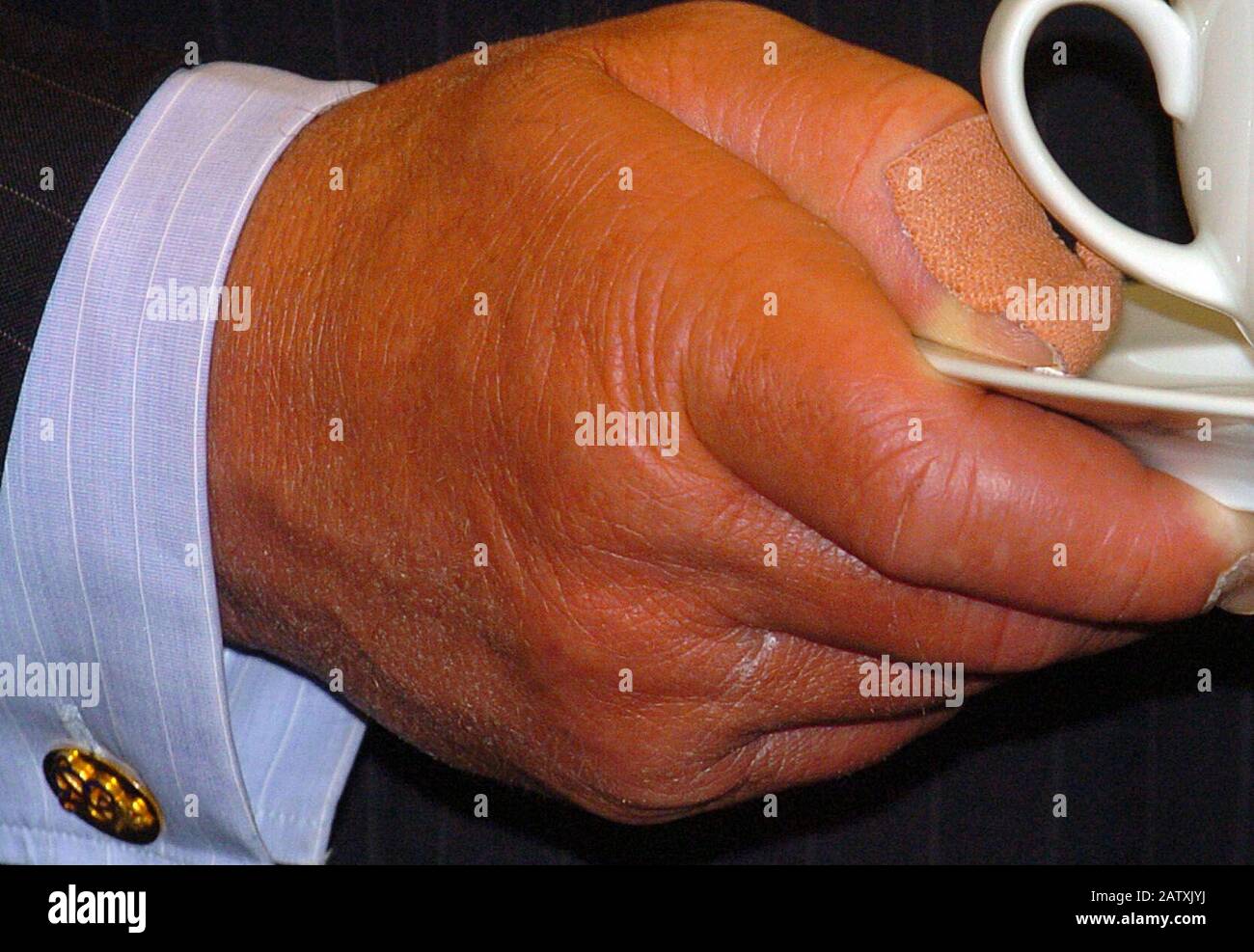 Hand of The Prince of Wales holding a cup of tea at the opening of 6.6 million pound project for the restoration of the Dutch House at Kew Palace in  Kew Gardens, West London in 2006. Stock Photo