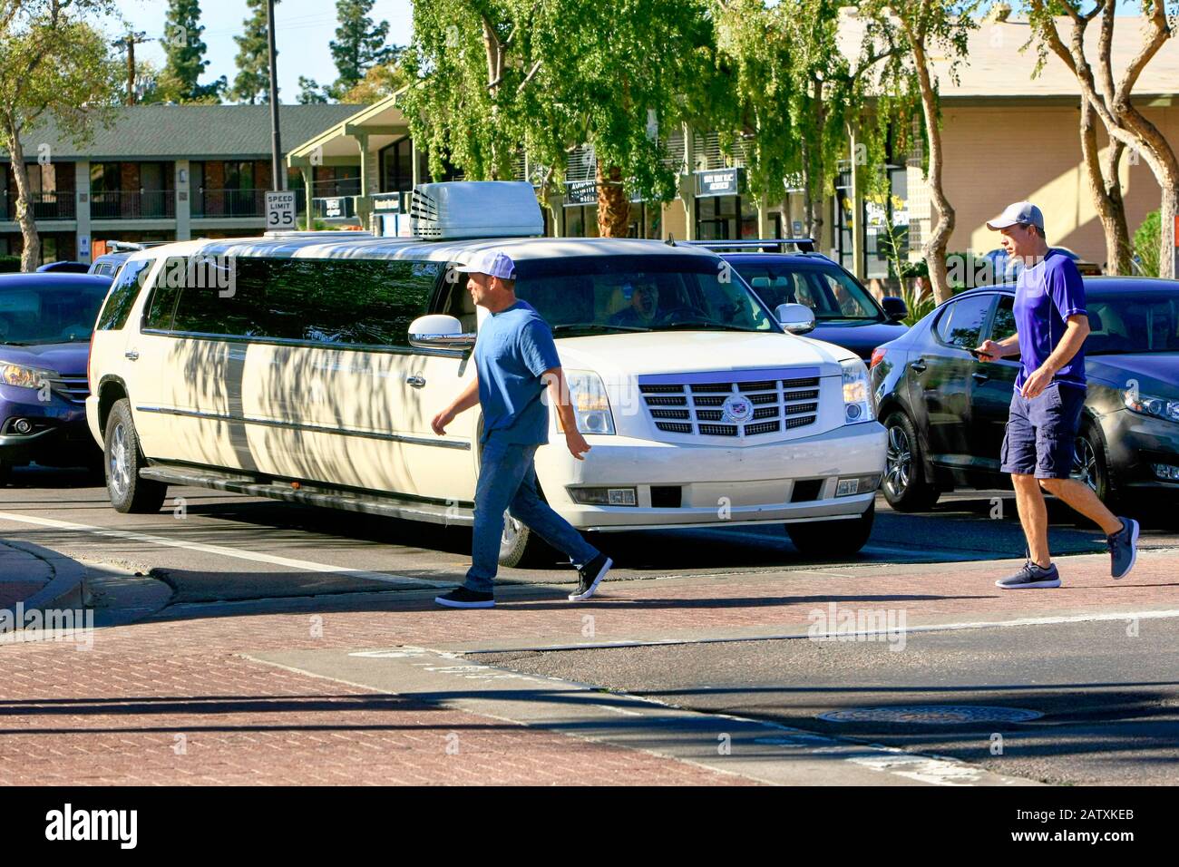 A white Cadillac limousine in downtown Old Town Scottsdale AZ Stock Photo