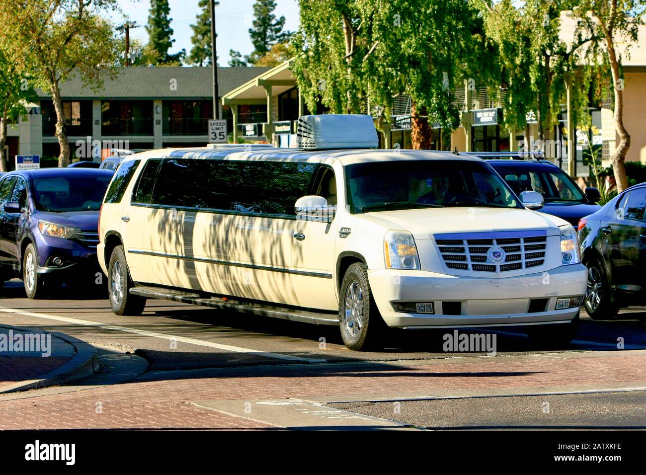 A white Cadillac limousine in downtown Old Town Scottsdale AZ Stock Photo