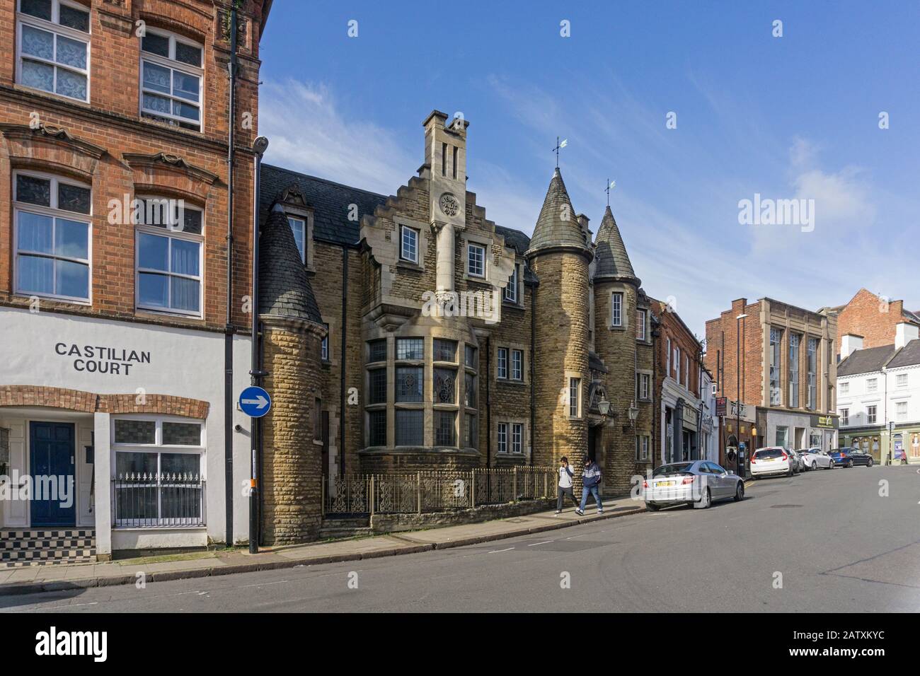 Street view of Castillian Street, Northampton, UK; the castle like building on the left is the Memorial Hall from 1921 by Alexander Ellis Anderson Stock Photo