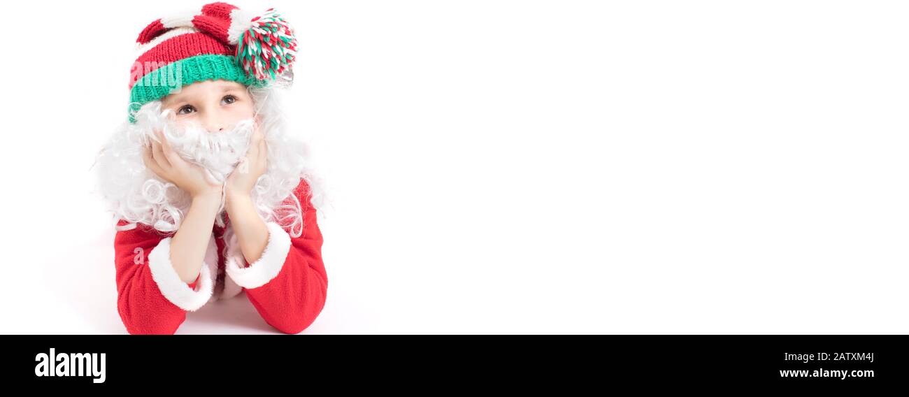 Banner Child Santa Claus in a knitted hat. Christmas boy on a white background.Christmas holidays concept Stock Photo