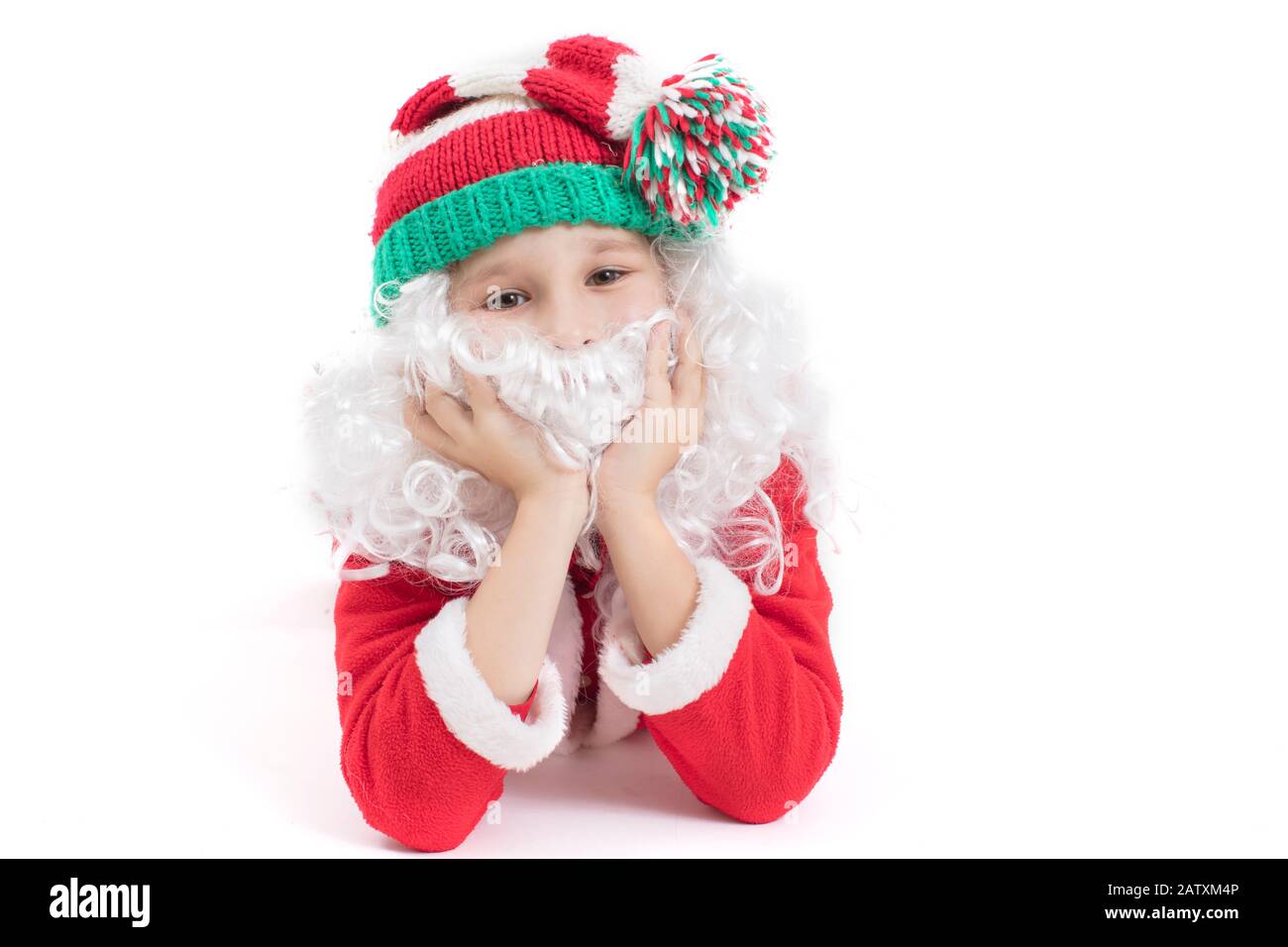 Child Santa Claus in a knitted hat. Christmas boy on a white background.Christmas holidays concept Stock Photo