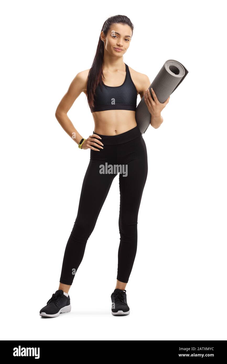 Full length portrait of a young female holding an exercise mat isolated ...