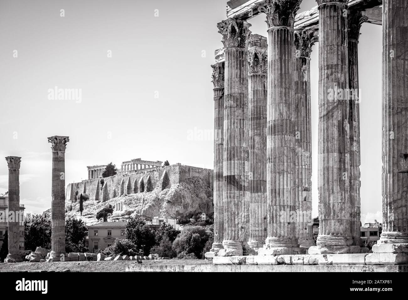 Temple of Olympian Zeus overlooking the famous Acropolis, Athens, Greece. Great Temple of Zeus or Olympieion is one of the main landmarks of Athens. A Stock Photo