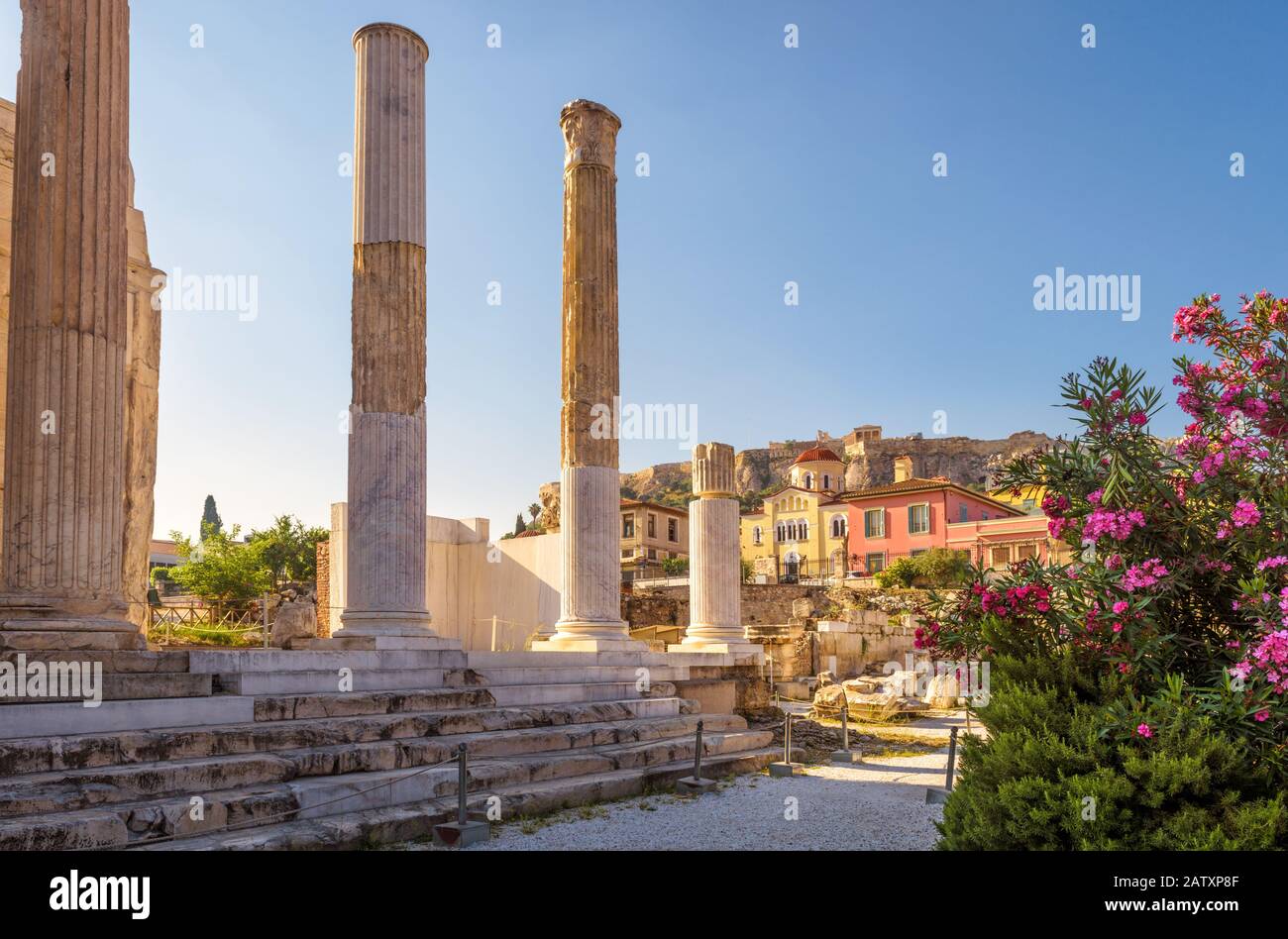 Library of Hadrian in Athens, Greece. It is a famous landmark of Athens. Panorama of Ancient Greek ruins among flowers in the Athens center. Scenic vi Stock Photo