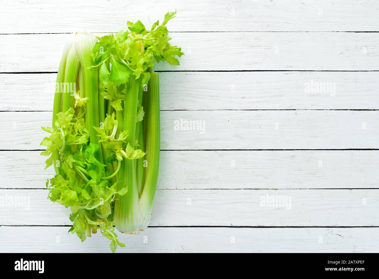 Fresh green celery. Healthy food. Top view. Free space for your text