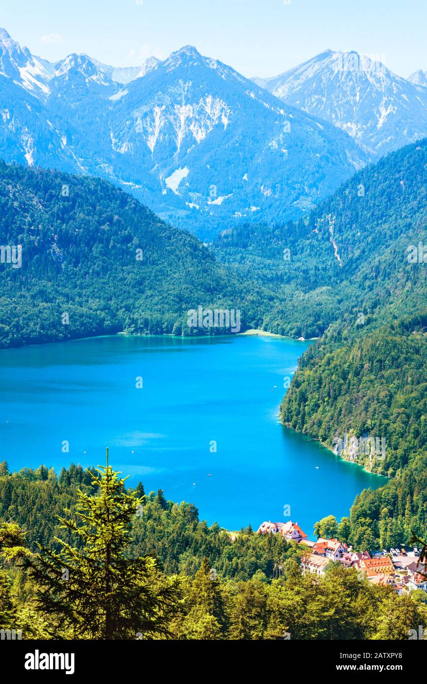 Landscape of Alpine mountains, Germany. Beautiful scenic view of nature from above. Nice landscape with Alpsee lake and Hohenschwangau village in fore Stock Photo