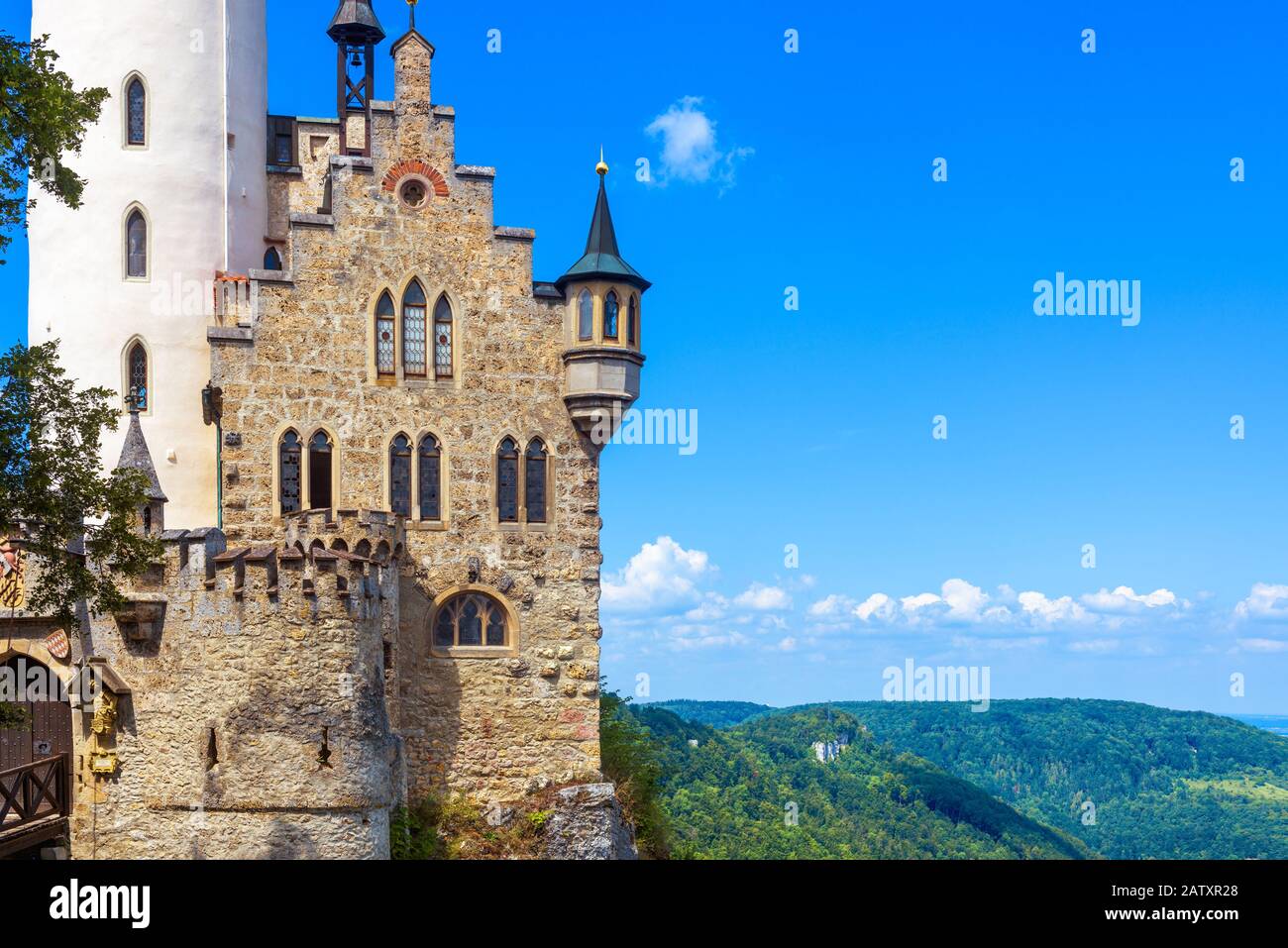 Lichtenstein Castle on blue sky background, Germany. It is a famous landmark of Baden-Wurttemberg. Scenic view of magic castle on a cliff. Mountain la Stock Photo