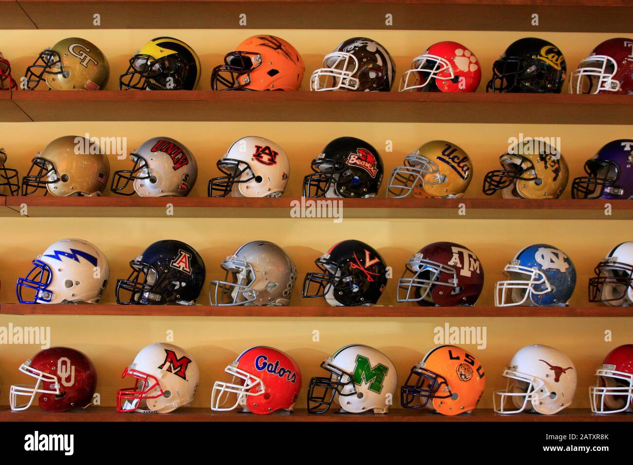 Collection of College Football helmets inside the Ziegler Fiesta Bowl Museum in Scottsdale AZ Stock Photo