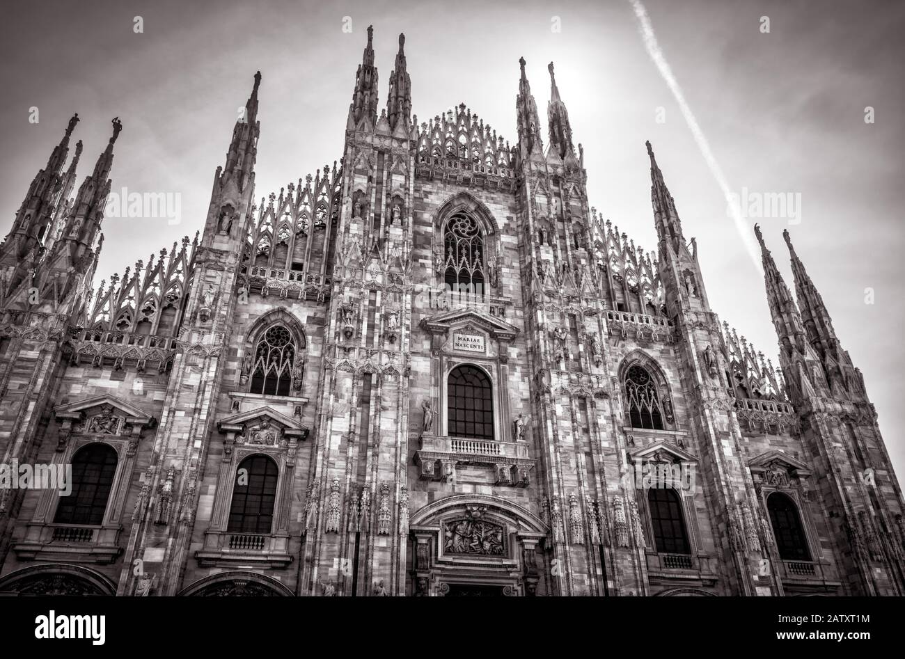 The famous Milan Cathedral (Duomo di Milano) on a sunny day in Milan, Italy. Milan Duomo is the largest church in Italy and the fifth largest in the w Stock Photo