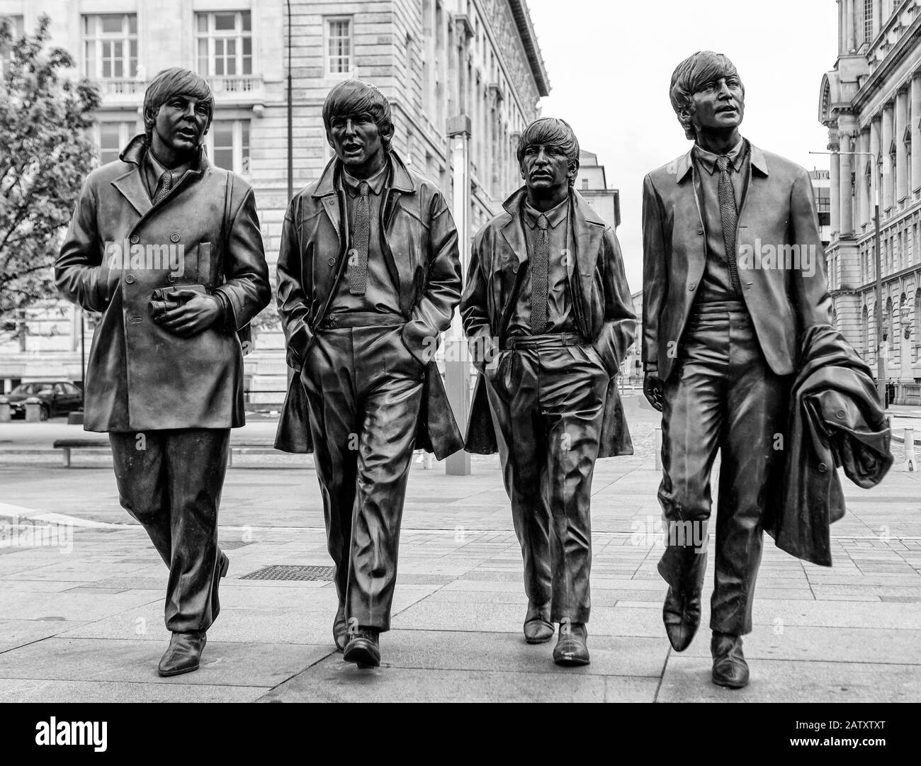 Bronze Statues of The Beatles located on Pier Head, They were created by Andy Edwards and unveiled in December 2015 Stock Photo