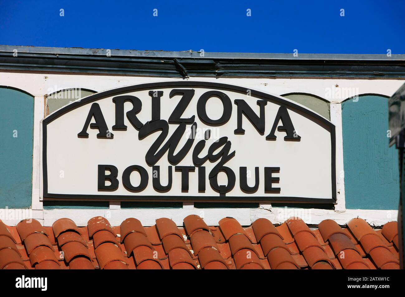 Close up of the Arizona Wig Boutique sign on 5th Ave shopping district of Old Town Scottsdale AZ Stock Photo