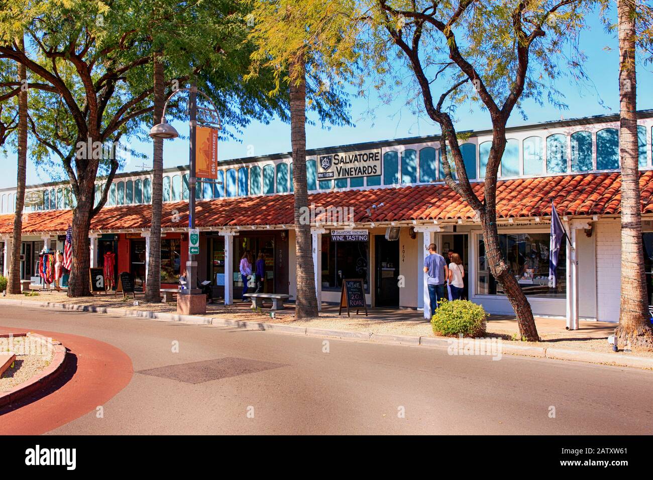 People enjoying the free parking and welcoming stores in the 5th Ave shopping district of Old Town Scottsdale AZ Stock Photo
