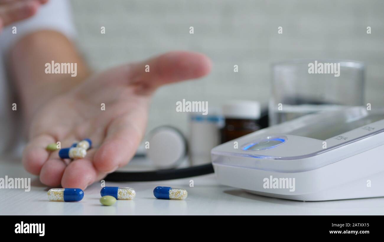 Man in Hospital Take Medicines for a Heart Affection After Checking His Blood Pressure Stock Photo
