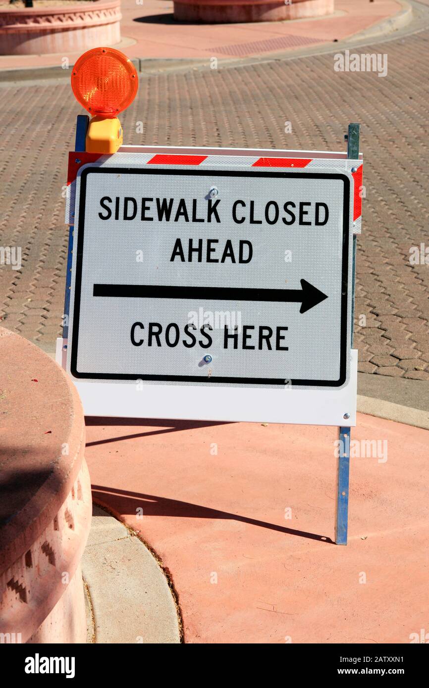 Sidewalk Closed sign USE OPPOSITE SIDE SIGN left ARROW