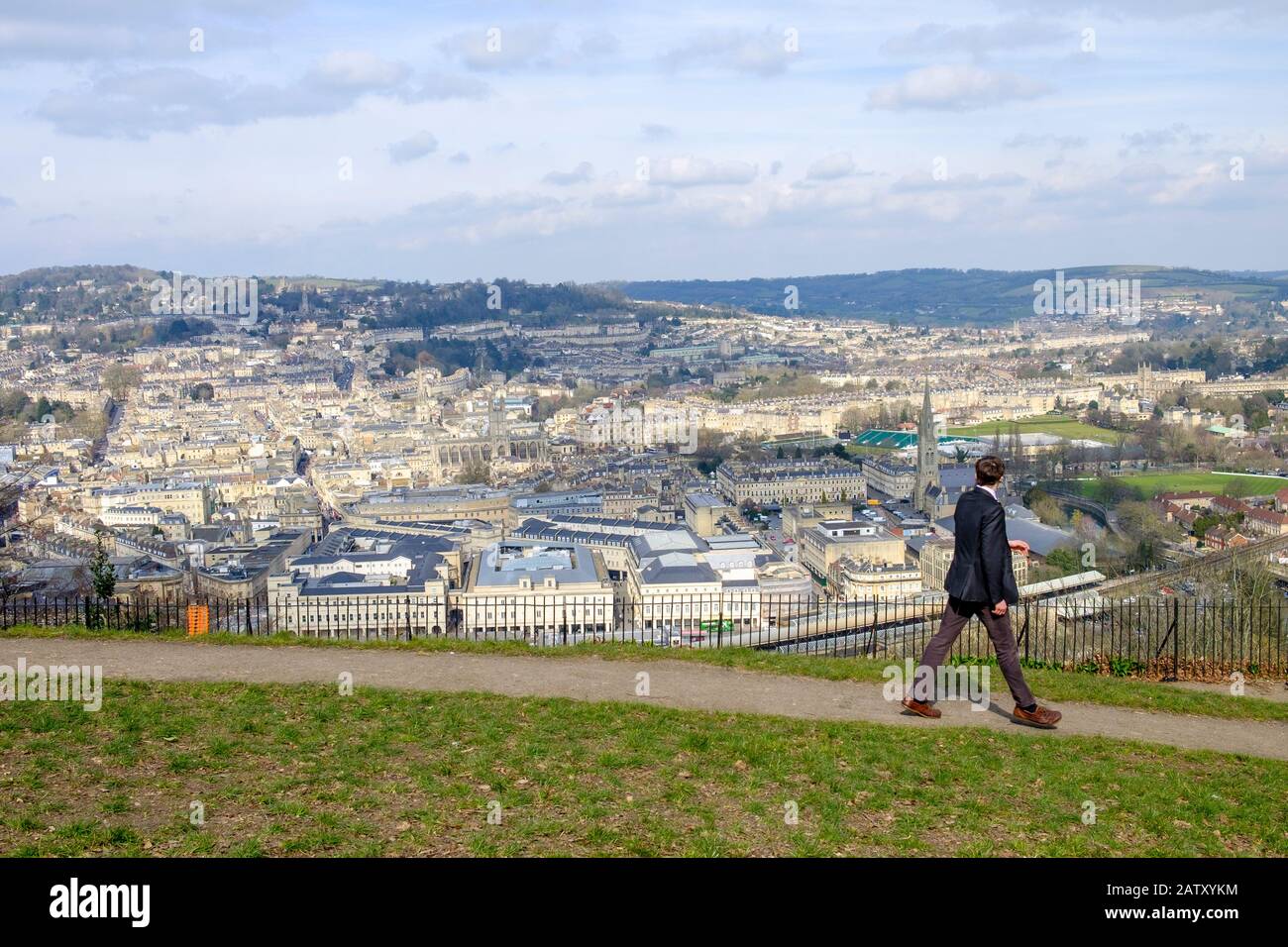 People taking advantage of the high vantage point view are pictured in Alexandra Park looking down at the city of Bath. Bath Somerset England uk Stock Photo